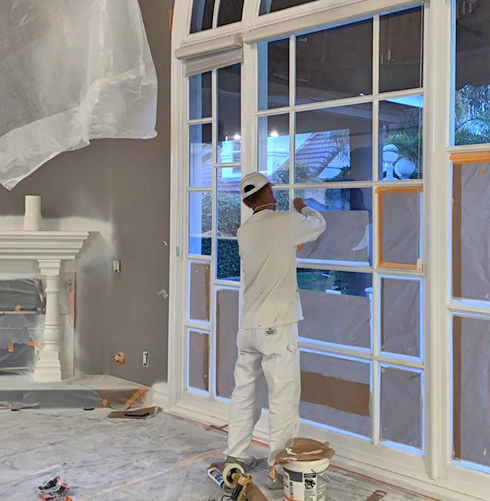 Painters painting commercial buildings